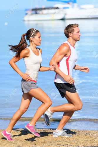 28636089-running-couple-runners-jogging-on-beach-training-together-man-stock-photo.jpg